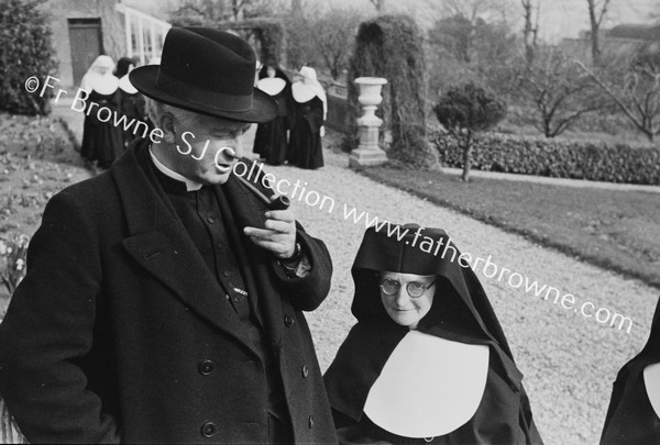 REV P O'TOOLE WITH RUINS AT BANDON CONVENT